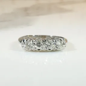 Four Sparkling Diamonds in Curvy White Gold Band