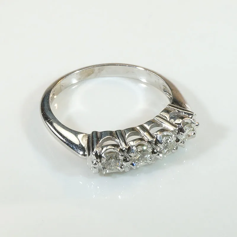 Four Sparkling Diamonds in Curvy White Gold Band